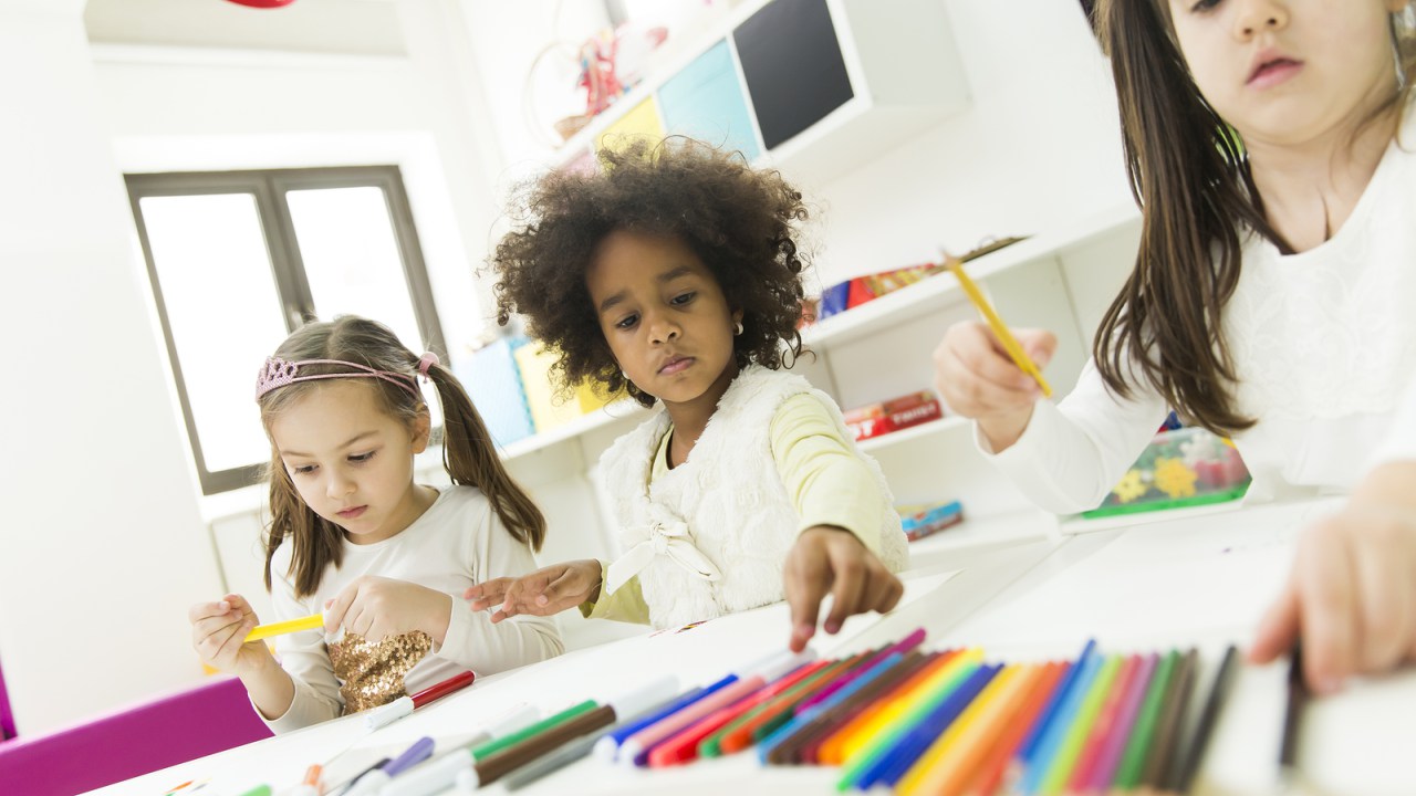 Cute multiracial children playing in the playroom