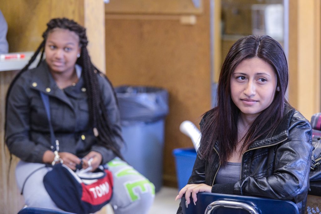 Two girls of color in a school room
